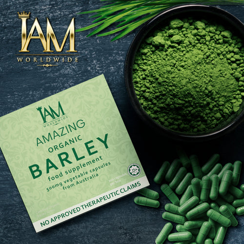 Green barley supplement packaging with powder, capsules, and IAM Worldwide logo on a dark background